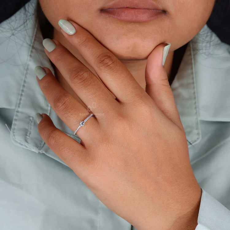 Handmade engagement ring with IGI-certified round cut diamond.