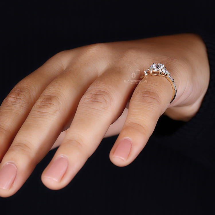 Prong setting on 3 stone engagement ring.