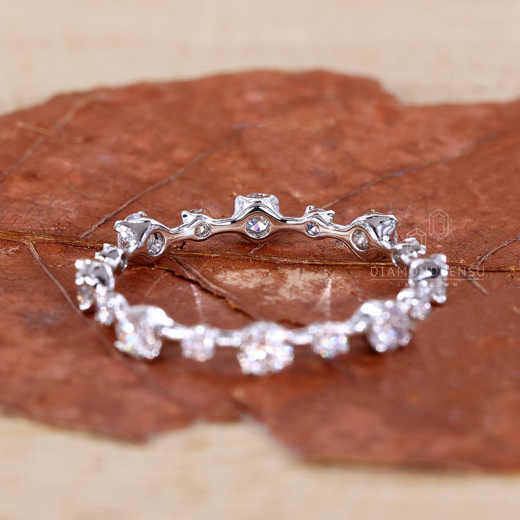 Elegant round cut diamond distance pave wedding band