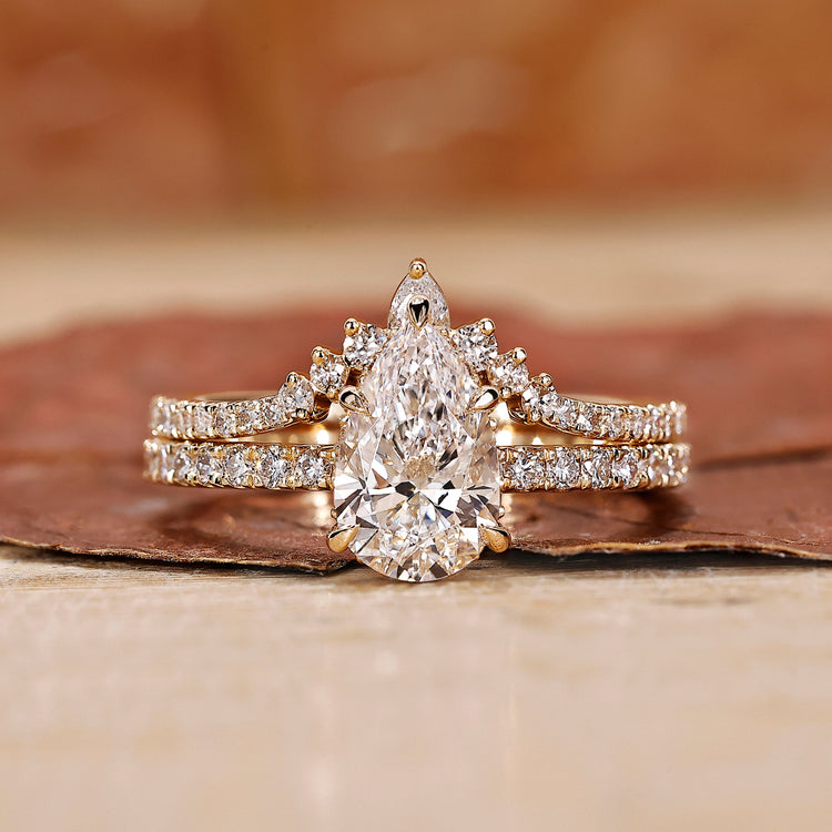 Pear shape engagement ring with band.