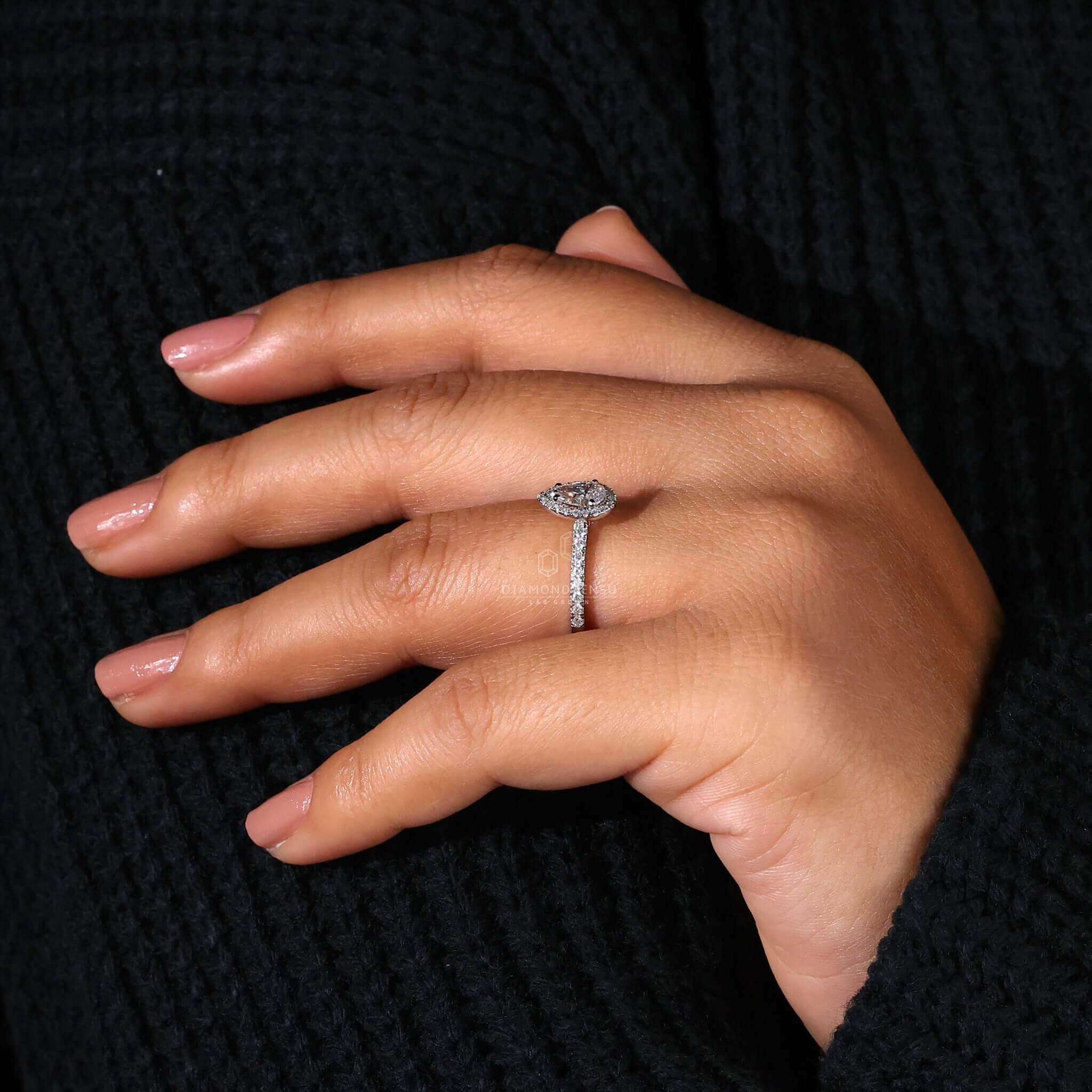 Halo ring with pave ring accents, making it an elegant engagement ring with pave details for women.