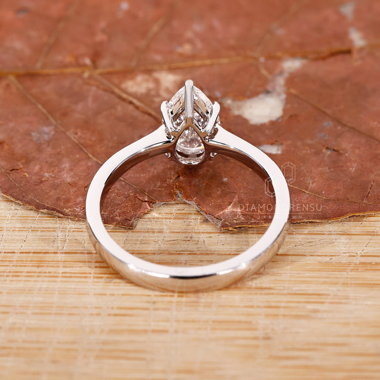 UK engagement ring designed with tapered pave style.