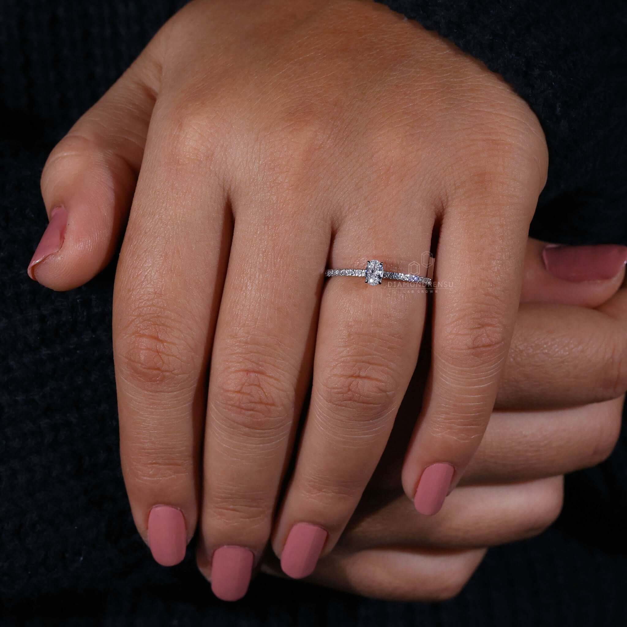 Oval diamond crafted in a hidden halo engagement ring, a perfect choice for unique engagement ring designs.