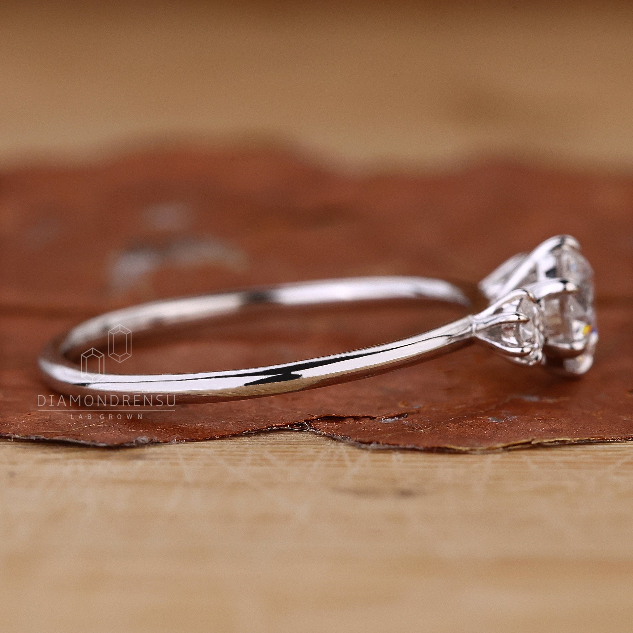 UK engagement ring with round cut diamonds.