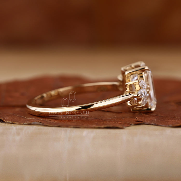 Yellow gold engagement ring with emerald diamond.