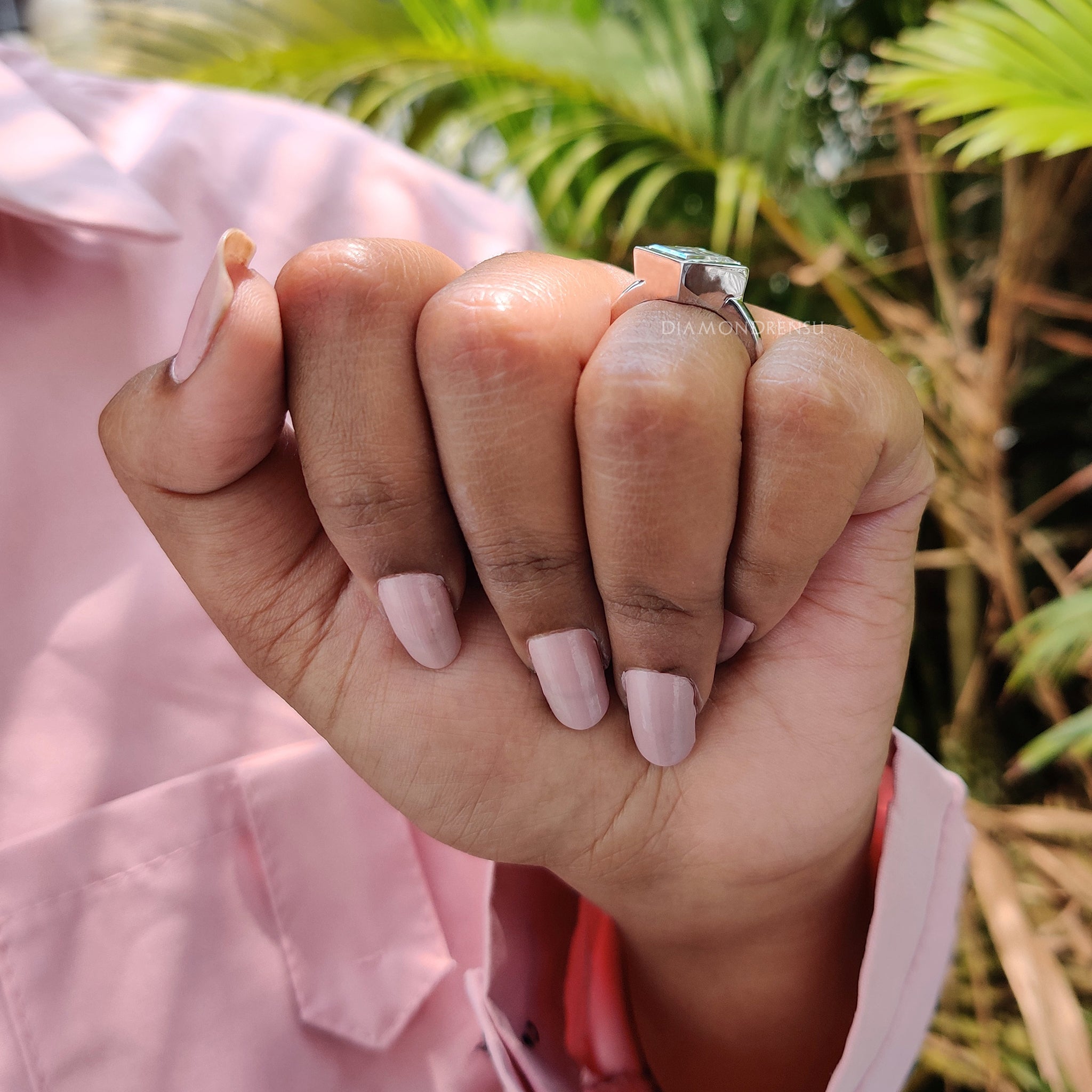 Handmade jewelry featuring lozenge cut moissanite center.