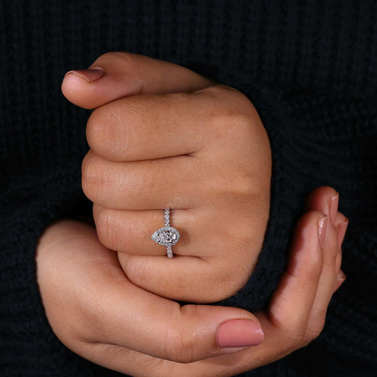 Pear shaped diamond ring with a classic 4 prong diamond ring setting for durability and elegance.