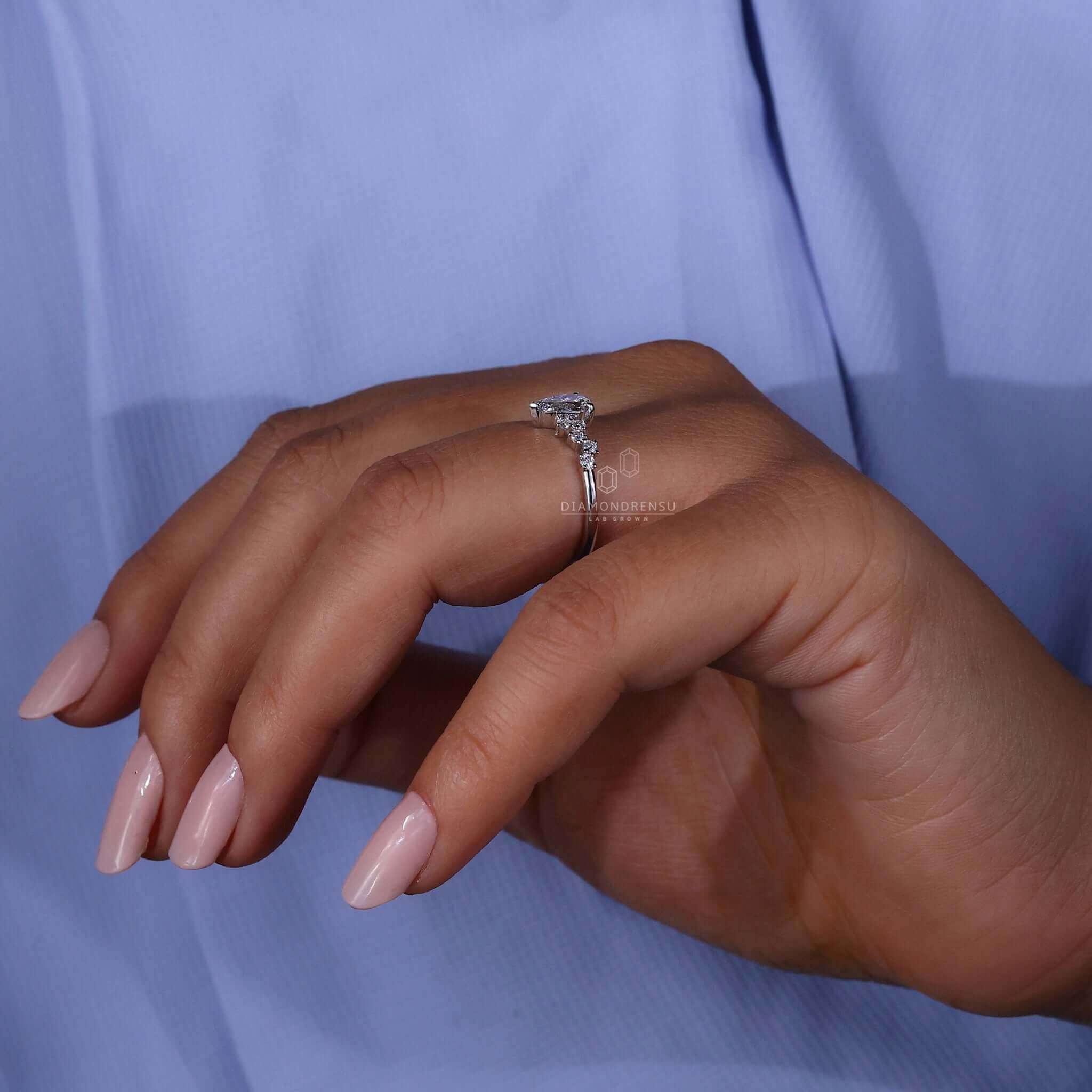 Zig Zag Pave Engagement Ring with pear cut diamond and handmade craftsmanship for a one-of-a-kind design.