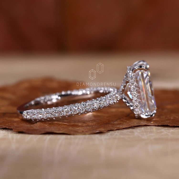 Hidden halo engagement ring with a unique diamondrensu UK style.
