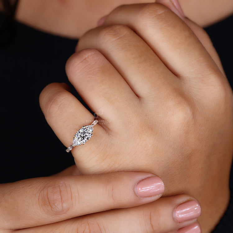 Cushion cut ring featuring 2 trillion side stones.