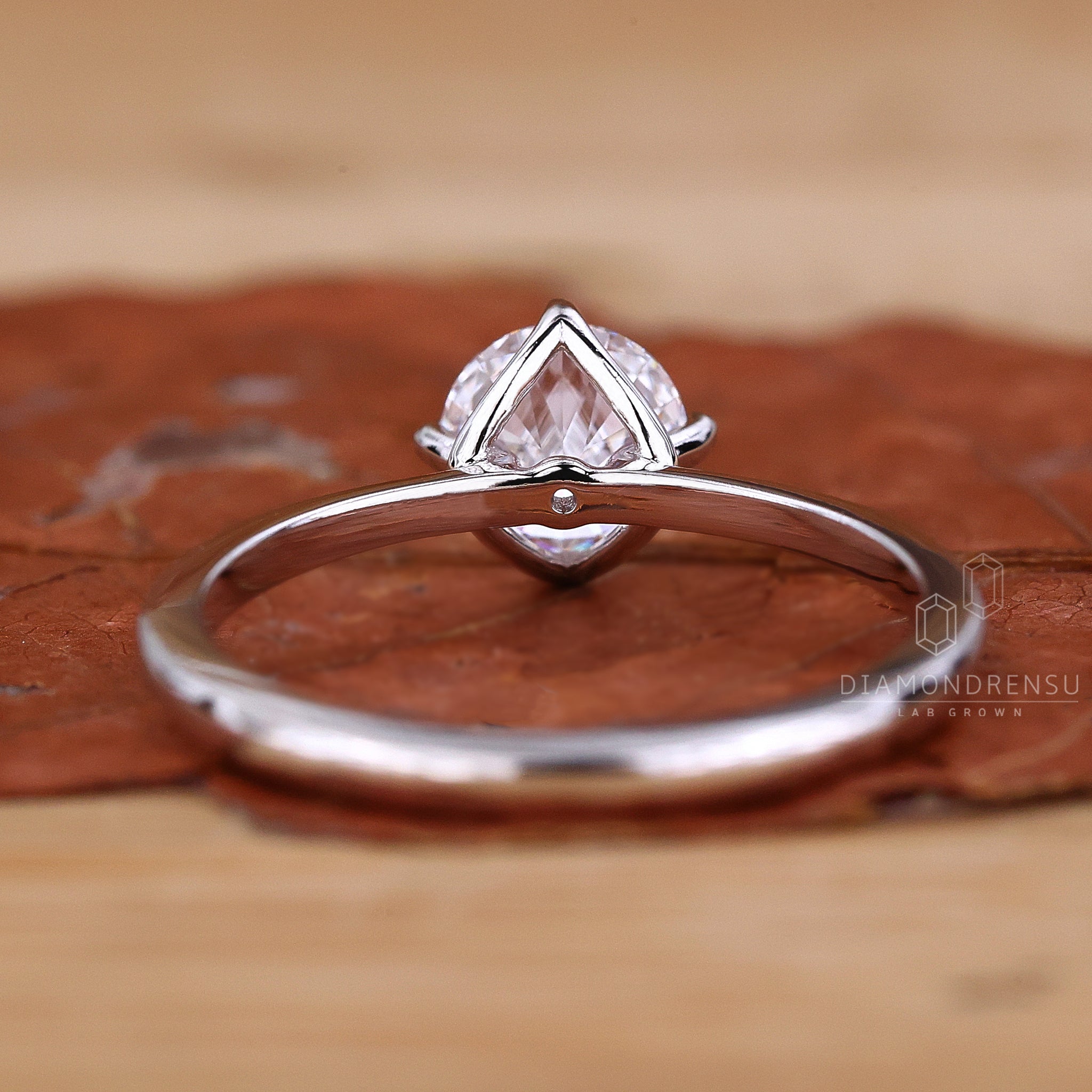 Lab diamond ring with round solitaire cut.