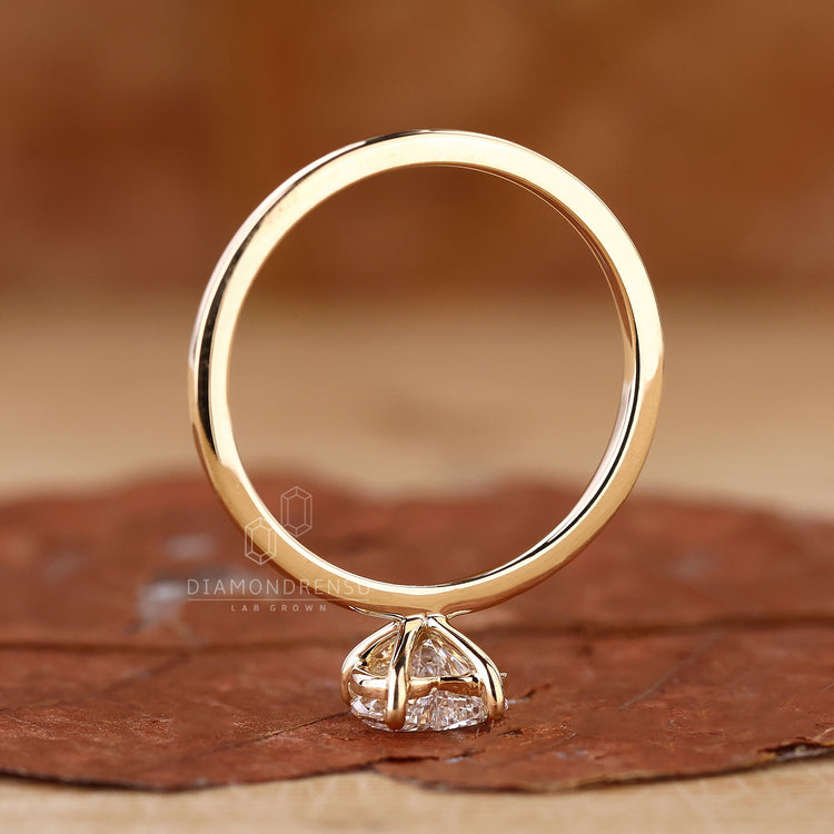 UK engagement ring with heart solitaire style.