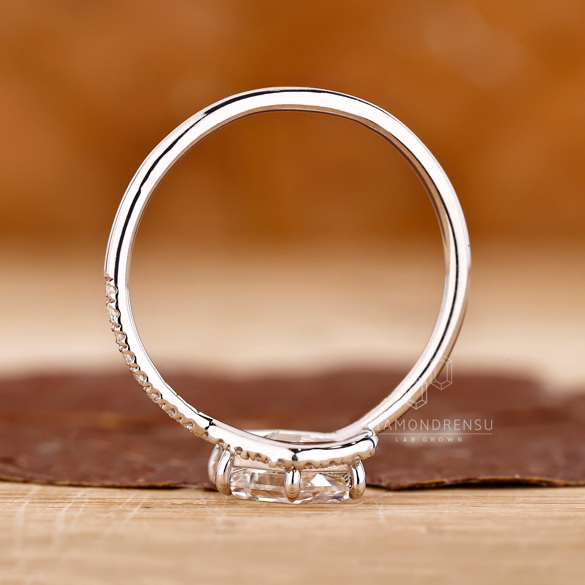 Handmade radiant cut ring with leaf-inspired prongs