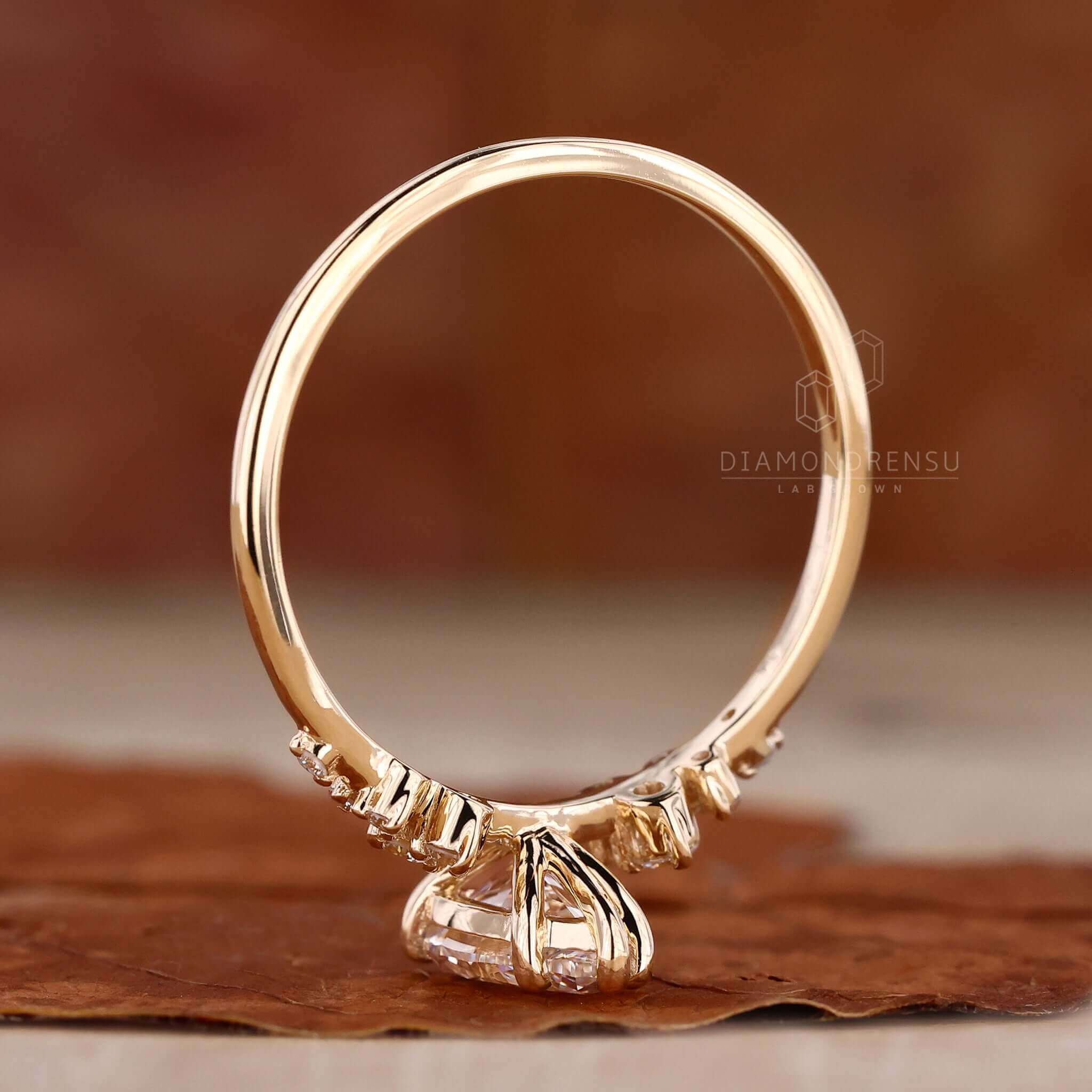 Engagement ring for women with a round diamond ring in a classic yellow gold setting.