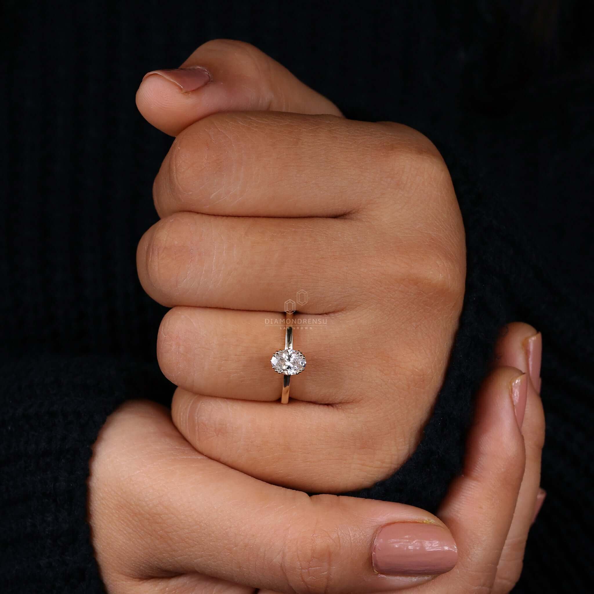 Oval solitaire ring with a modern 3 prong setting design.
