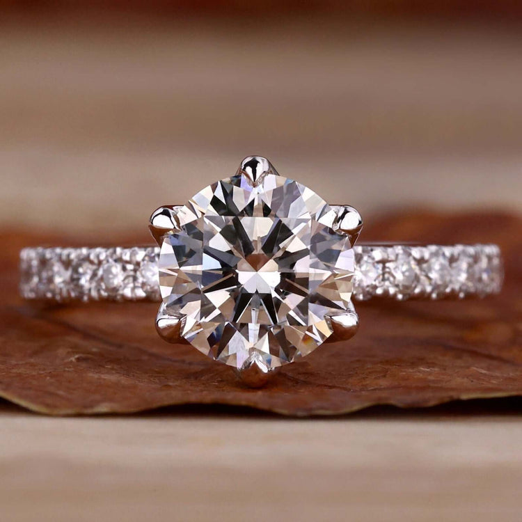 Round Diamond Engagement Ring with a brilliant cut diamond in a tulip basket setting, perfect for classic engagement looks.