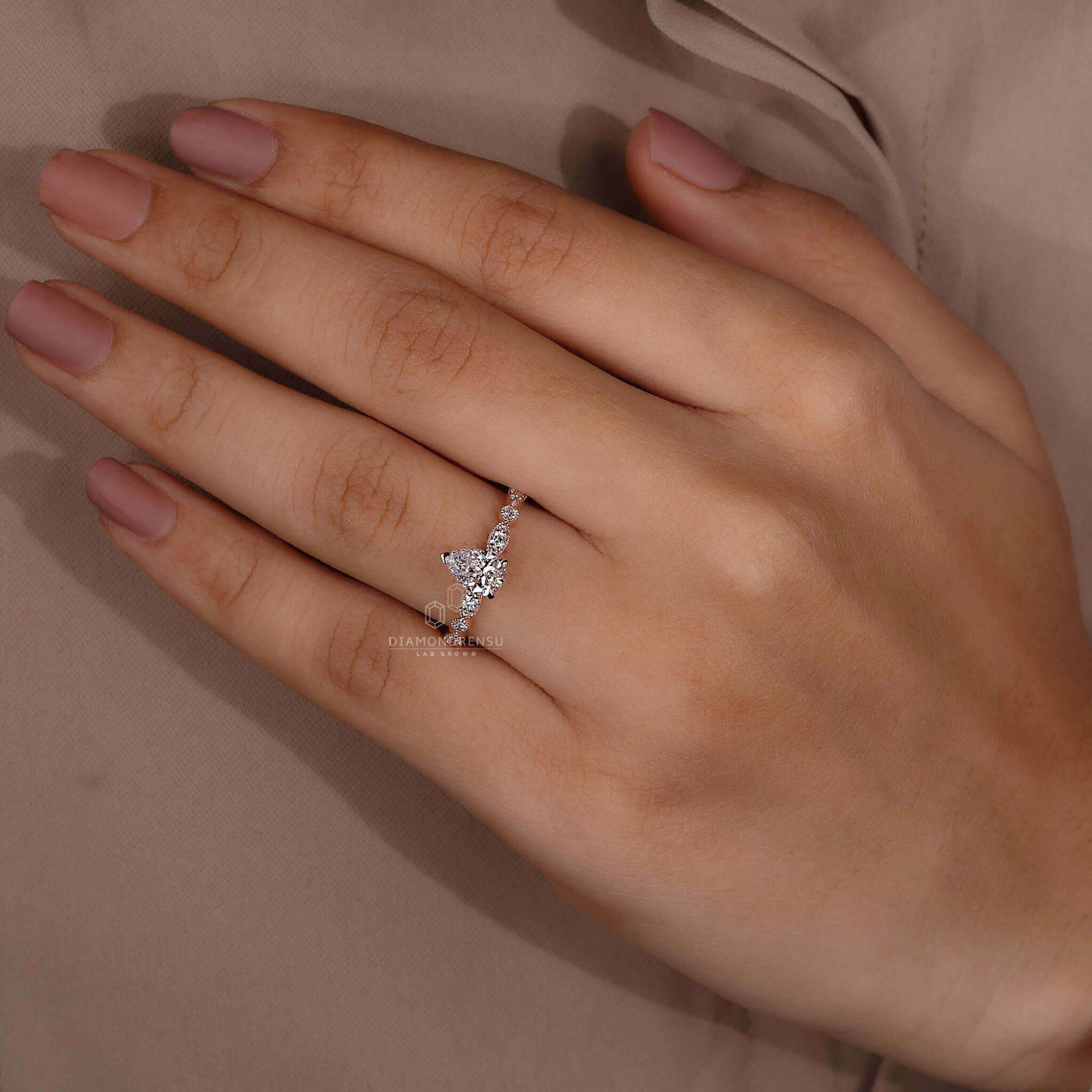 Pear shaped diamond ring with a claw prong ring setting, crafted for brilliance and style.