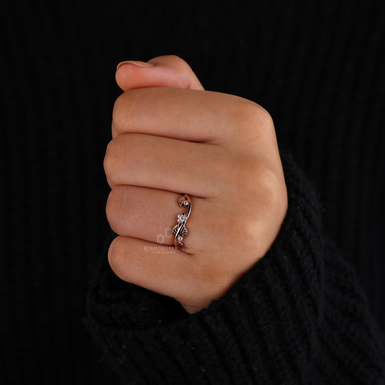 Custom diamond band with leaf shapes and round cut accents.