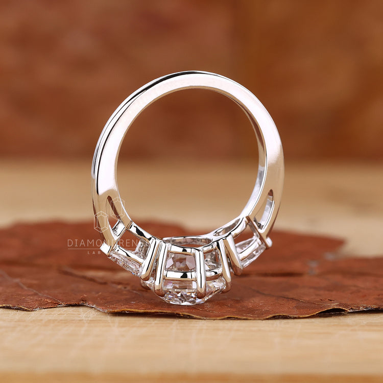 Buy engagement ring in UK with pear side stones.