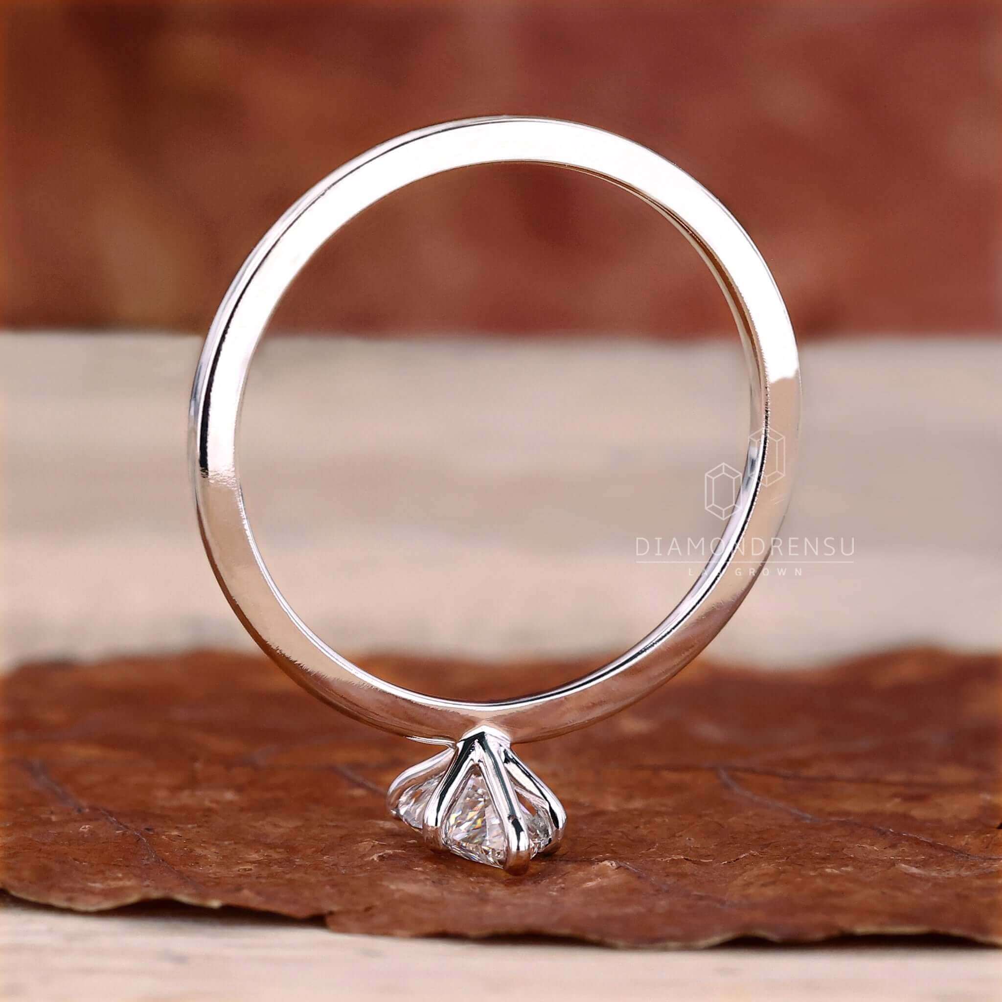 Pear solitaire engagement ring showcasing tear drop elegance.
