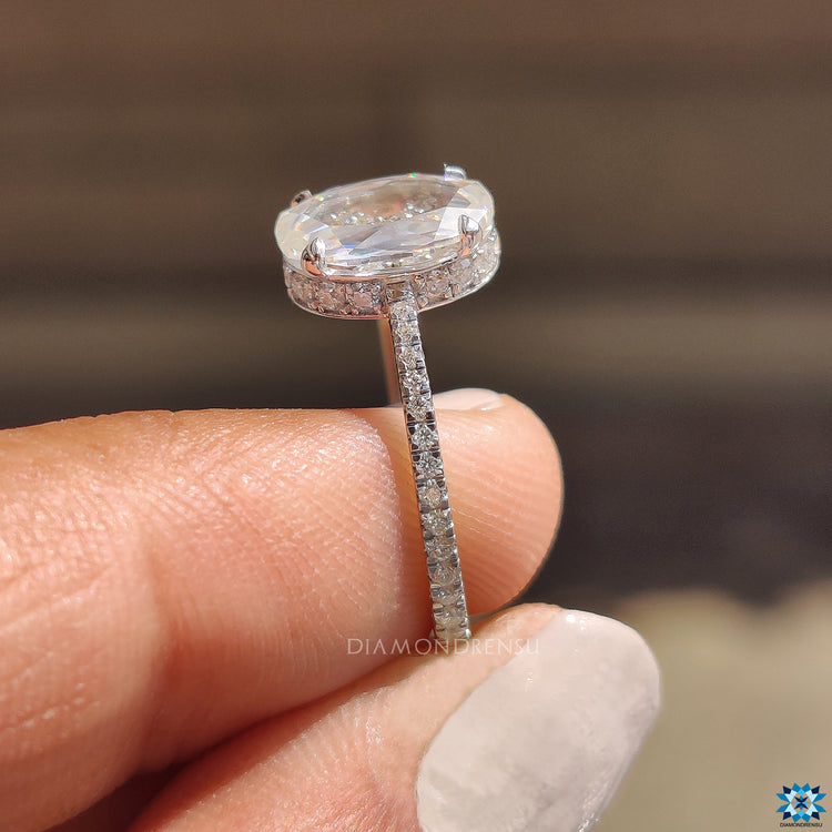 Handmade oval rose cut moissanite ring with hidden halo and white gold.