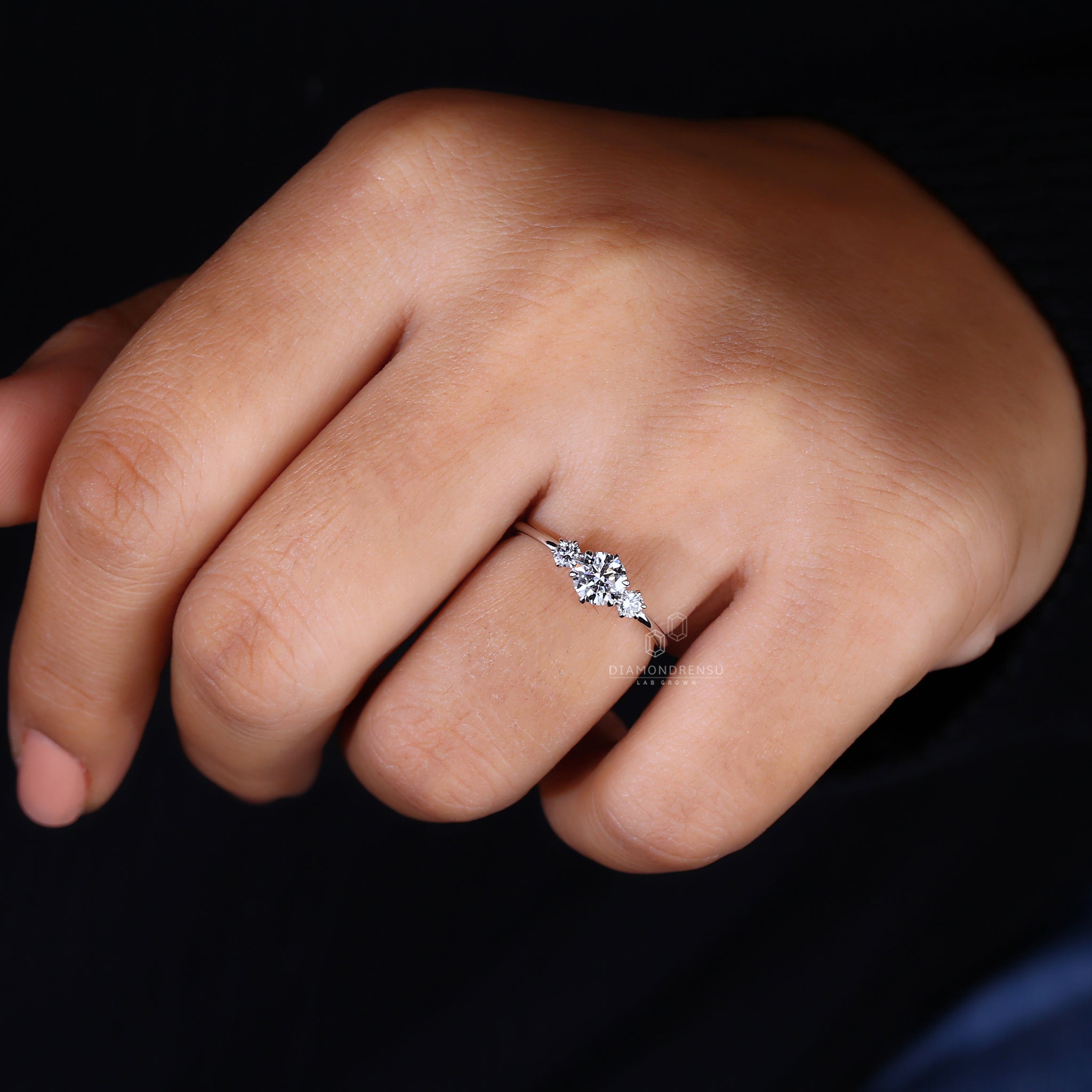 6 claw prong setting three stone ring.