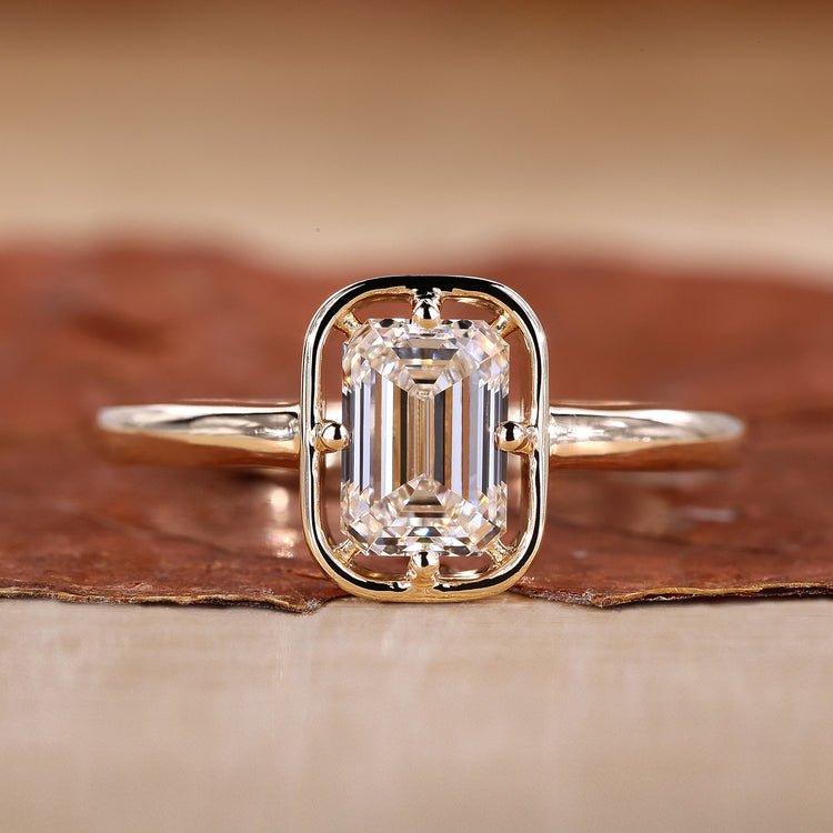 Emerald Cut Engagement Ring is designed with yellow gold ring.