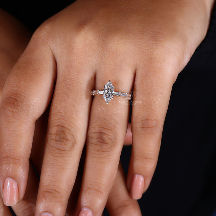 Baguette cut side stone with marquise center.