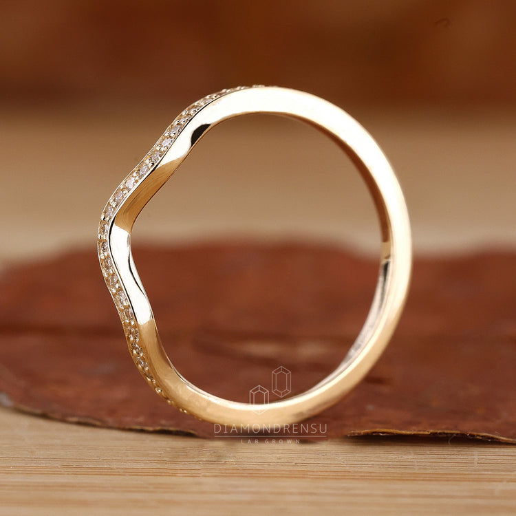 Elegant curved diamond wedding band UK