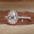 Stunning oval engagement ring with a halo ring setting for added brilliance. Stunning oval engagement ring with a halo ring setting for added brilliance.