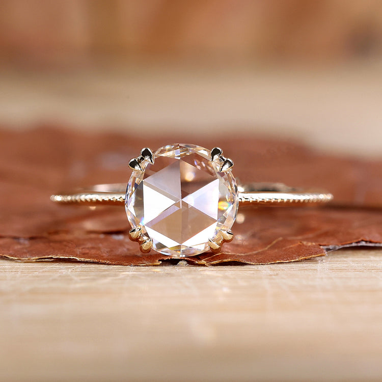 Round rose cut diamond ring with knife edge shank and milgrain setting.