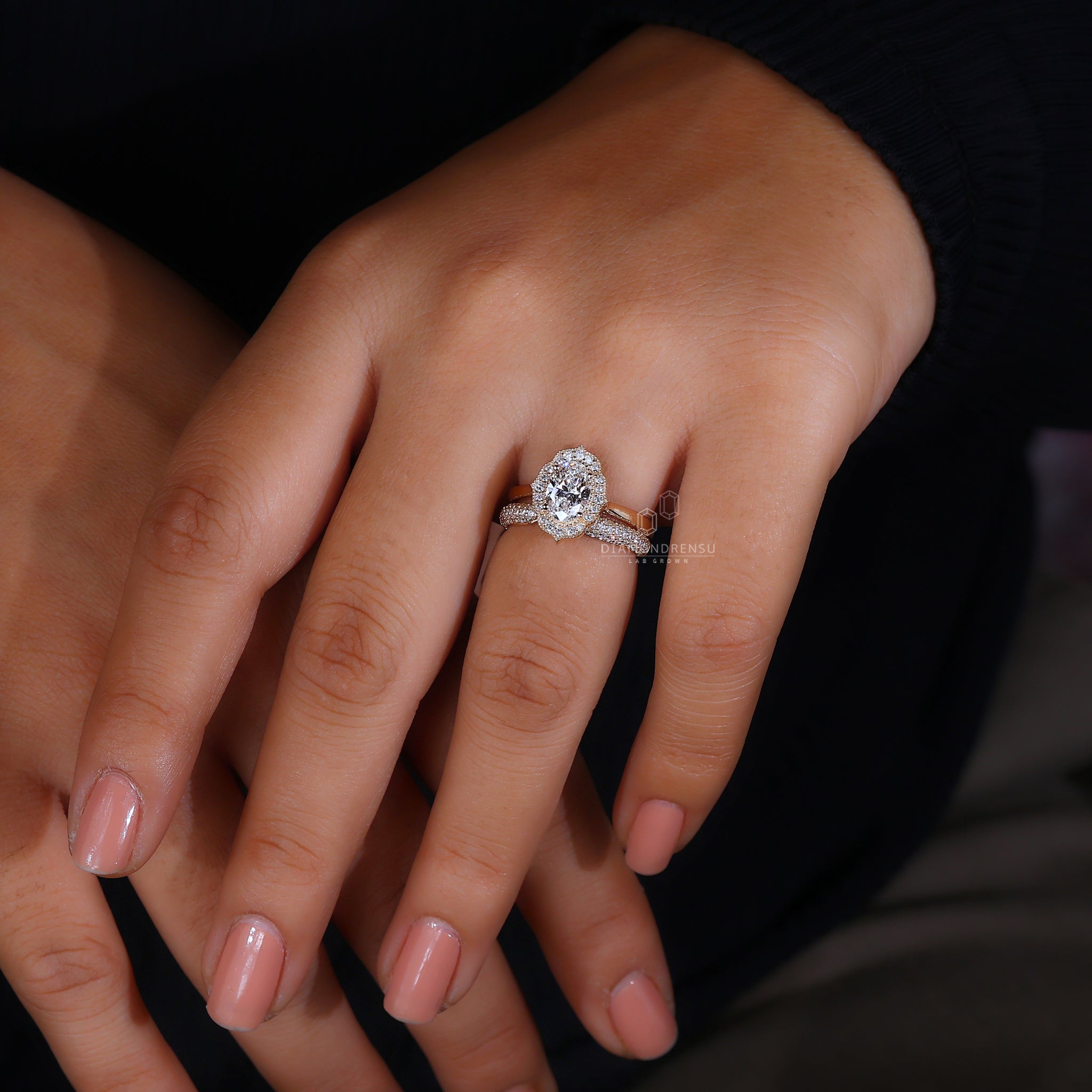 Oval engagement ring and diamond band.