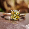 Cushion cut solitaire ring with canary yellow moissanite.