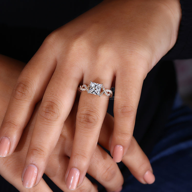 Round diamond ring adds detail beside the princess cut.