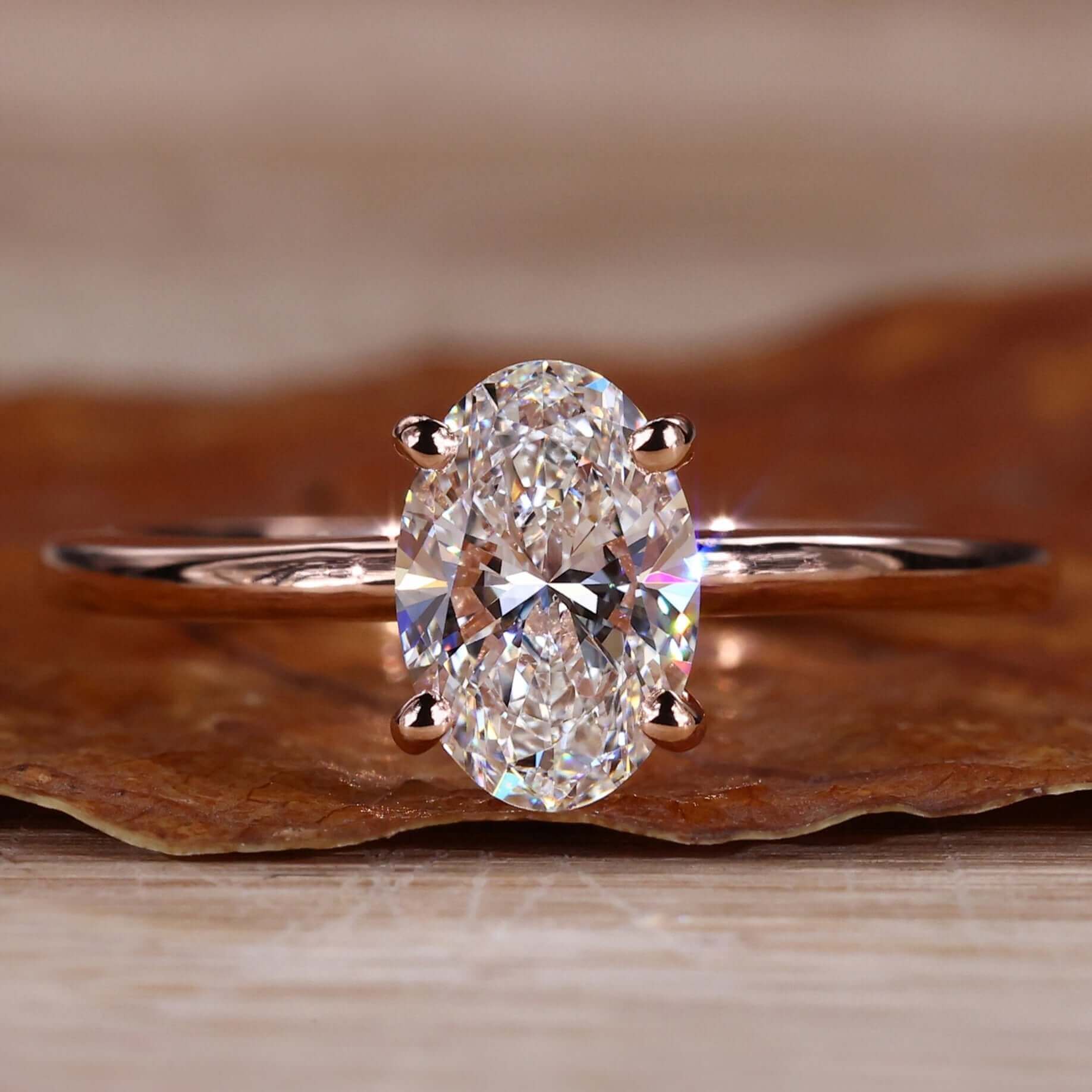 Gold Oval Diamond Engagement Ring with a timeless solitaire setting for elegance.
