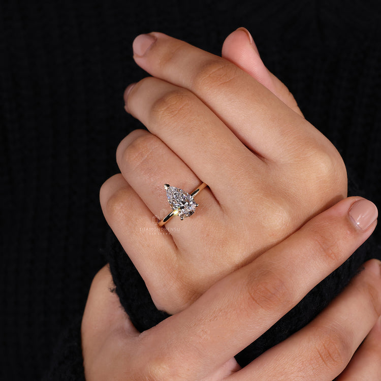 Solitaire engagement ring with V prong setting.