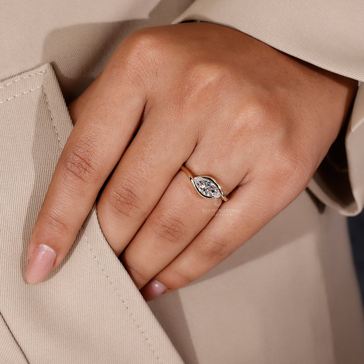 Handmade jewellery piece with east west marquise diamond in yellow gold.