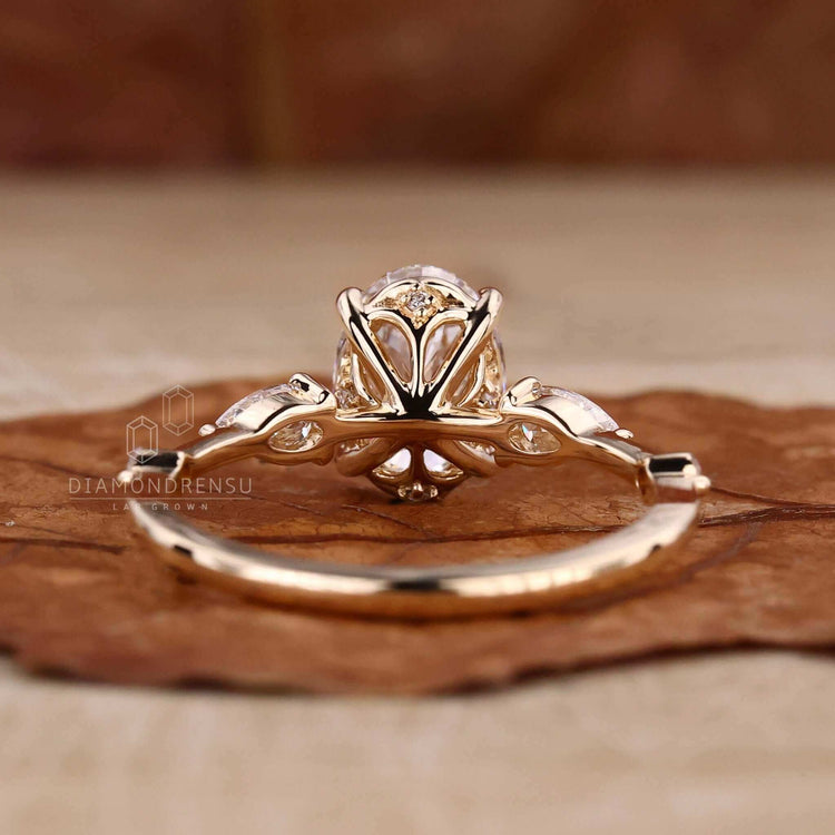 Oval cut diamond engagement ring paired with round side stones, a unique design for your special UK engagement.