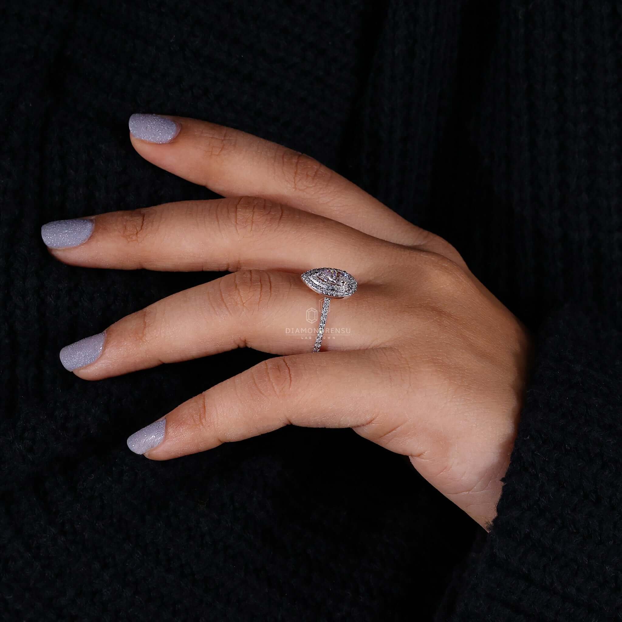 Pear diamond ring featuring a double halo engagement ring design crafted for brilliance.