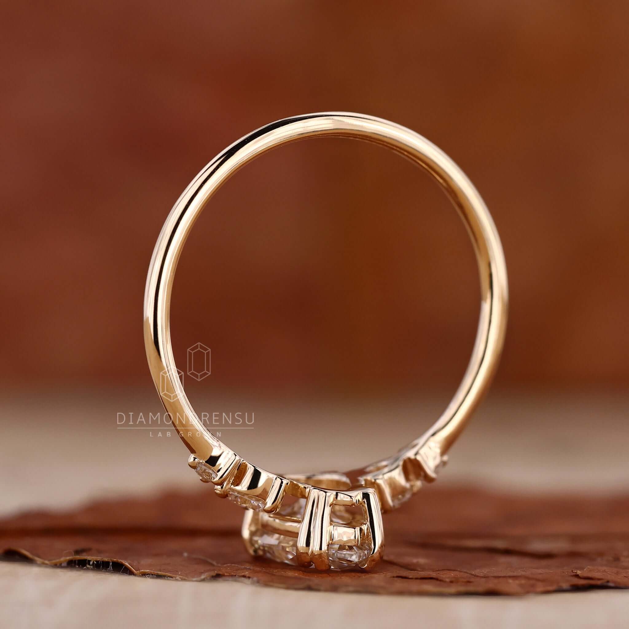 Pear ring crafted in yellow gold with a claw prong engagement ring style for added brilliance.