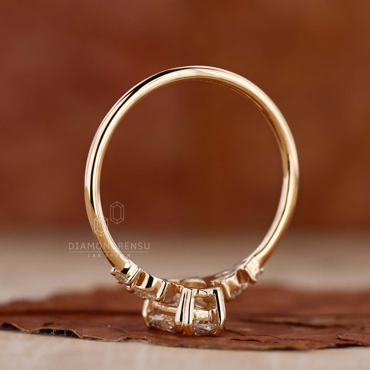 Pear ring crafted in yellow gold with a claw prong engagement ring style for added brilliance.