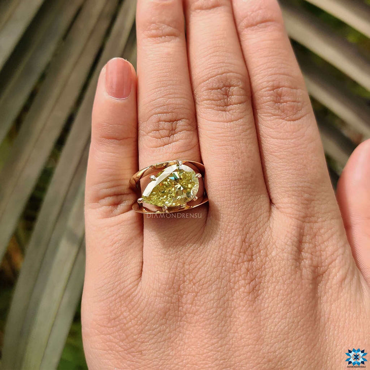 Pear cut solitaire moissanite engagement ring.