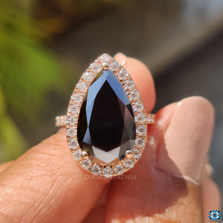 Handmade black moissanite engagement ring with halo and pave design.