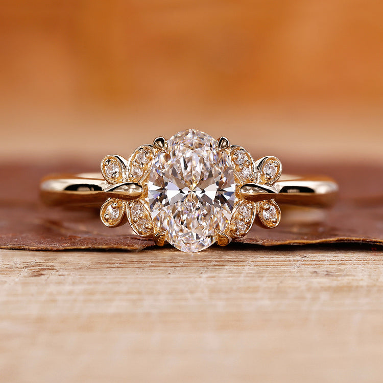 Oval Diamond Engagement Ring is designed with yellow gold ring.