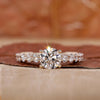 Round cut diamond ring with detailed milgrain ring setting.
