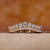 Curved diamond wedding band in yellow gold.
 Curved diamond wedding band in yellow gold.