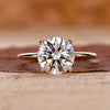 Round diamond engagement ring with a 4 claw prong setting.