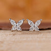 Butterfly stud earrings in white gold.
