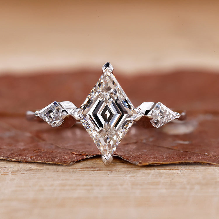 3 stone engagement ring with lozenge cut ring design.