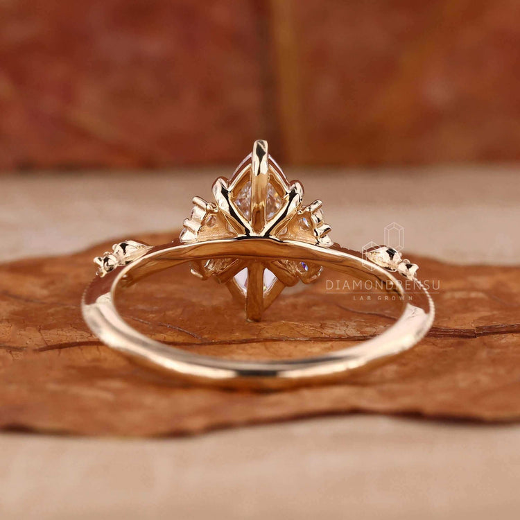 Unique marquise cut engagement ring with handmade detail.